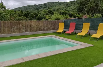 a group of chairs sitting next to a swimming pool at Casa Vilar (Taboadela-Ourense) in Taboadela