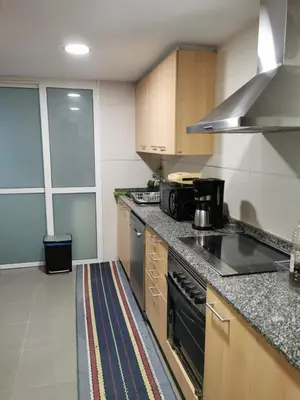 a kitchen with a stove and a counter top at ALE HOSPEDAJE GALICIA in Temple