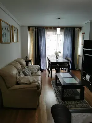 a living room with a couch and a table at ALE HOSPEDAJE GALICIA in Temple