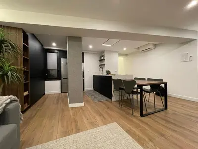 a dining room and kitchen with a table and chairs at C&G Ático Céntrico con Terraza in Ourense