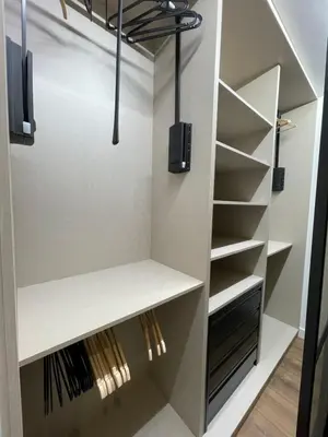 a walk in closet with shelves and lights at C&G Ático Céntrico con Terraza in Ourense