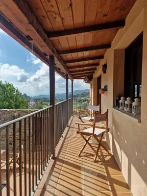 a balcony of a house with chairs on it at Casa Del Ingles - Luxury Private Villa & Pool in Rural Valley in Pontevedra