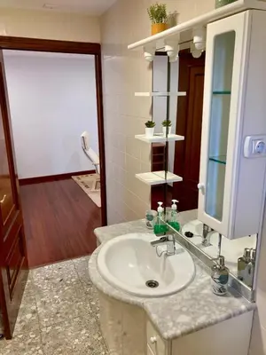a bathroom with a sink and a mirror at A casa de Lago in Lago