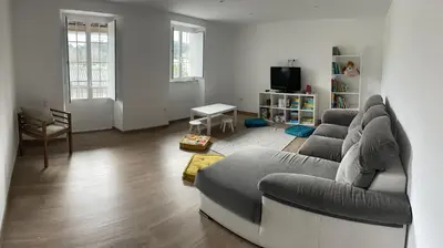 a living room with a couch and a chair at A casa de Lago in Lago