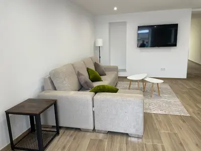 a living room with a couch and a table at A casa de Lago in Lago