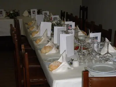 a long table with plates of food on it at Hostal la Cuesta in Vega de Espinareda