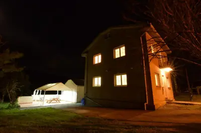 a house at night with its lights on at Casa Manuel in Vivero