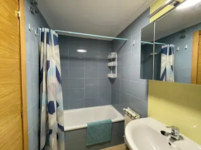 a bathroom with a sink and a bath tub at APARTAMENTO NUEVO EN BURELA - A Mariña, Galicia in Burela de Cabo