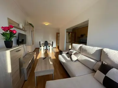 a living room with a couch and a table at APARTAMENTO NUEVO EN BURELA - A Mariña, Galicia in Burela de Cabo