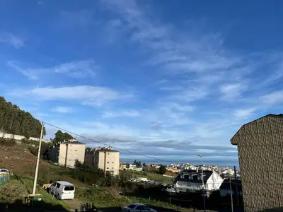 a view of a city with buildings and a blue sky at APARTAMENTO NUEVO EN BURELA - A Mariña, Galicia in Burela de Cabo