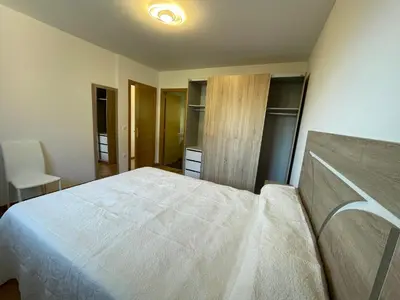 a bedroom with a large white bed in a room at APARTAMENTO NUEVO EN BURELA - A Mariña, Galicia in Burela de Cabo