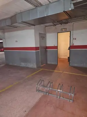 an empty parking garage with a door in it at Alojamiento A Tafona in Caldas de Reis