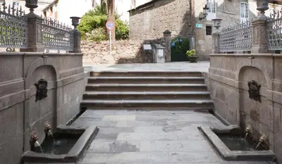 a set of stairs leading up to a building at Alojamiento A Tafona in Caldas de Reis