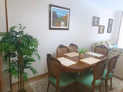 a dining room with a table and chairs at Sobre el Puerto in Viveiro