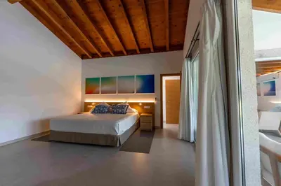 a living room with a couch and a tv at Reverence Villas Carballal in Palas de Rei