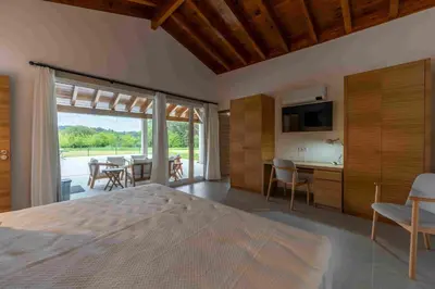 a kitchen with a washing machine and a washer at Reverence Villas Carballal in Palas de Rei