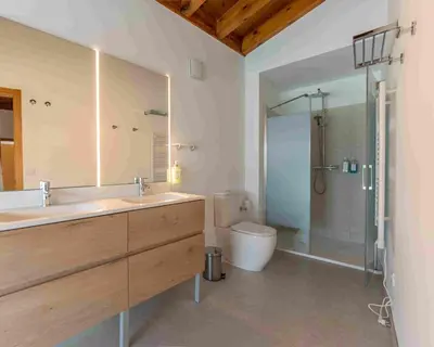 a patio with a table and a swimming pool at Reverence Villas Carballal in Palas de Rei