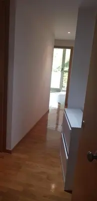 an empty room with a door and a hallway at Centro Viveiro in Viveiro