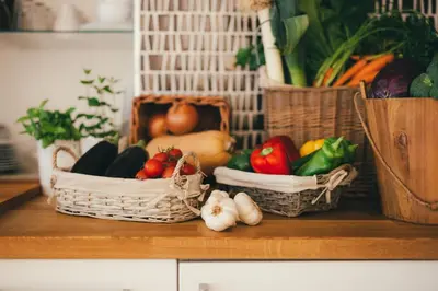 two baskets filled with fruits and vegetables on a counter at Apartamentos Aurelia Antica in Santiago de Compostela