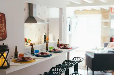 a kitchen with plates of food on a counter at Apartamentos Aurelia Antica in Santiago de Compostela