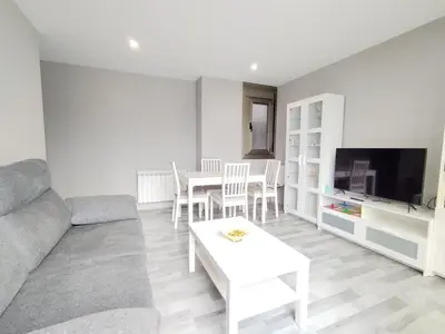 a living room with a couch and a table at Viveiro Bahía in Viveiro