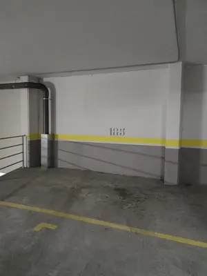 an empty parking garage with a white wall at Viveiro Bahía in Viveiro