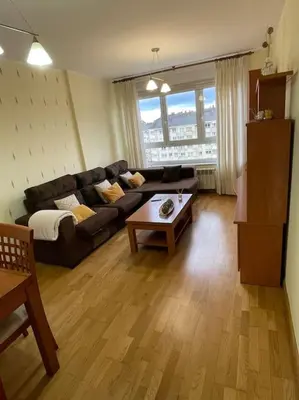 a living room with a couch and a coffee table at Apartamento Lugo Ciudad in Lugo