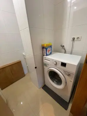 a washer and dryer in a small room at Apartamento Lugo Ciudad in Lugo