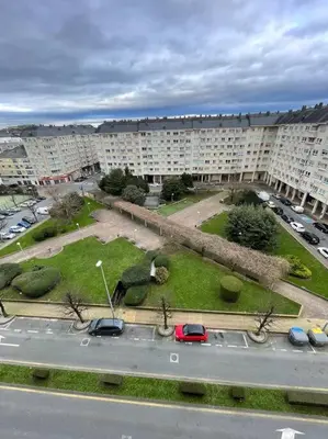 a view of a parking lot in a city with buildings at Apartamento Lugo Ciudad in Lugo