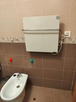 a bathroom with a white sink and a toilet at Ventana al Paraíso del Oso - Somiedo. Window to Bear Paradise - Somiedo in Pola de Somiedo