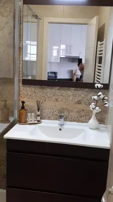 a bathroom with a white sink and a mirror at Apartamentos SARABIA LOFT in Ourense