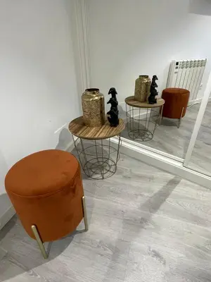 a room with two tables and a chair and a stool at Apartamentos SARABIA DARRIBA in Ourense