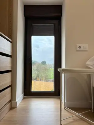 a room with a door with a window at Cabanas do Carpinteiro / Santiago de Compostela - Rías Baixas in Pontevedra