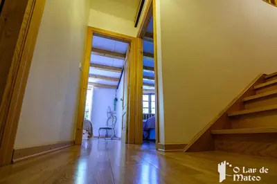 an empty room with a staircase in a house at O Lar de Mateo in Monforte de Lemos