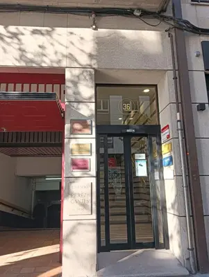 a door to a building with a sign in it at Pardiñas 36 in Santiago de Compostela