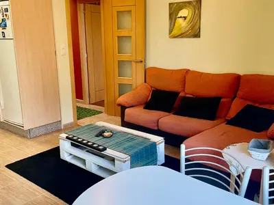 a balcony with a bench on the side of a building at Apartamento Luminoso y Acogedor in Lalín