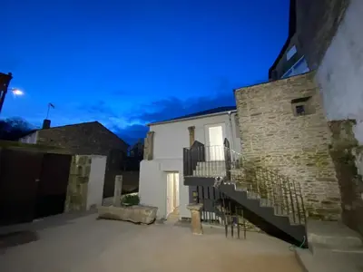 a building with a staircase in front of it at dpCristal Centro Histórico in Sarria