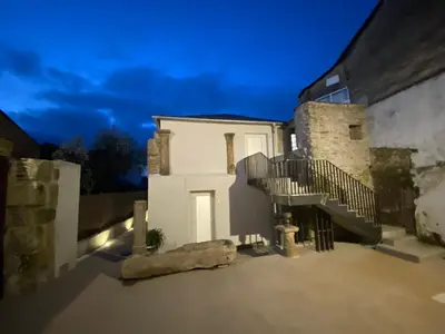 a white house with stairs on the side of it at dpCristal Centro Histórico in Sarria