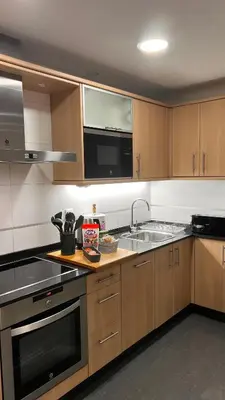 a kitchen with a sink and a stove top oven at Acogedor piso céntrico in Lugo