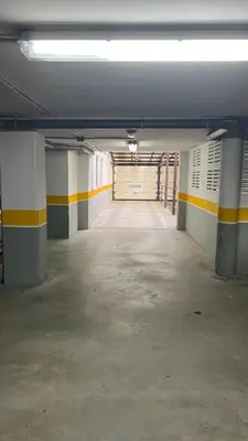an empty parking garage with a large garage door at Acogedor piso céntrico in Lugo