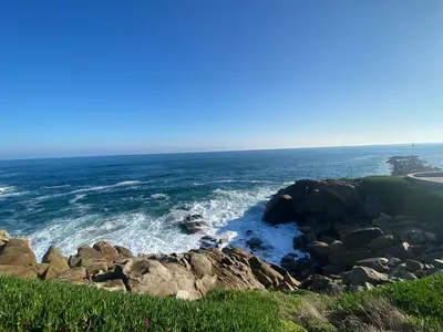 a view of the ocean from a bluff at Apartamentos LAMAROSA -LAS PLAYAS in Burela de Cabo