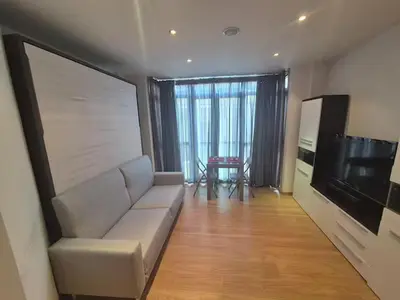 a living room with a couch and a flat screen tv at Alojamiento en Ares a 2 minutos de la playa in Ares