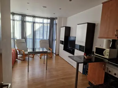 a living room with a table and a living room with a couch at Alojamiento en Ares a 2 minutos de la playa in Ares