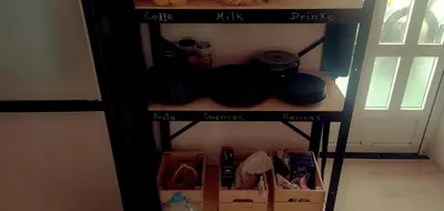 a shelf with plates and other items on it at Doctor Gasalla in Lugo
