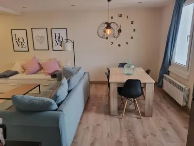 a living room with a couch and a table at Doctor Gasalla in Lugo