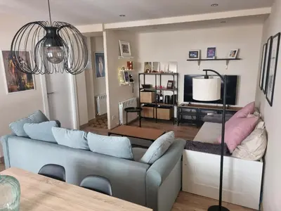 a living room with a couch and a television at Doctor Gasalla in Lugo