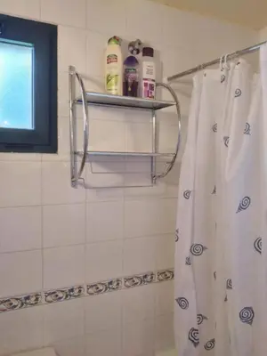 a bathroom with a shower with a shower curtain at La Casa de Trefacio in Trefacio