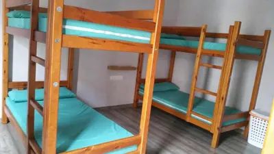a couple of bunk beds in a room at Albergue Pereiro in Melide