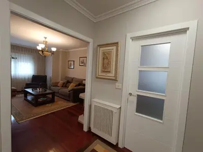 a living room with a door leading into a living room at Apartamento Plaza in Caldas de Reis