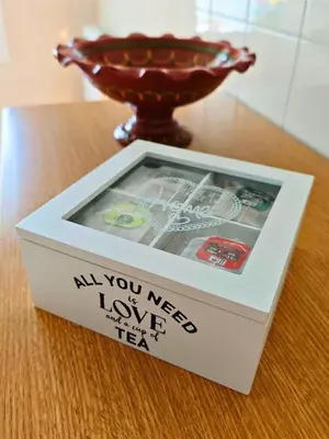 a box sitting on top of a table with a bowl at Apartamento Pena Furada in Ribadeo
